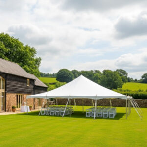9m x 12m white PVC traditional marquee being used for a wedding at a barn wedding venue
