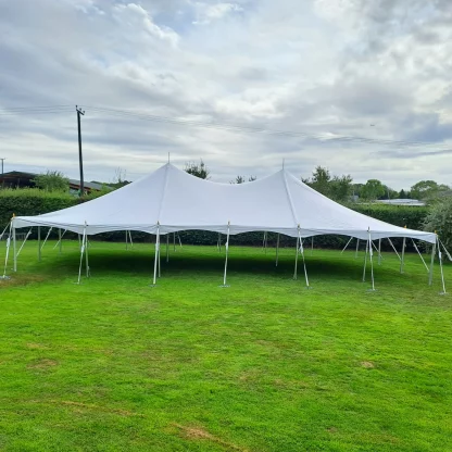 9m traditional marquee put up for a garden party -side view
