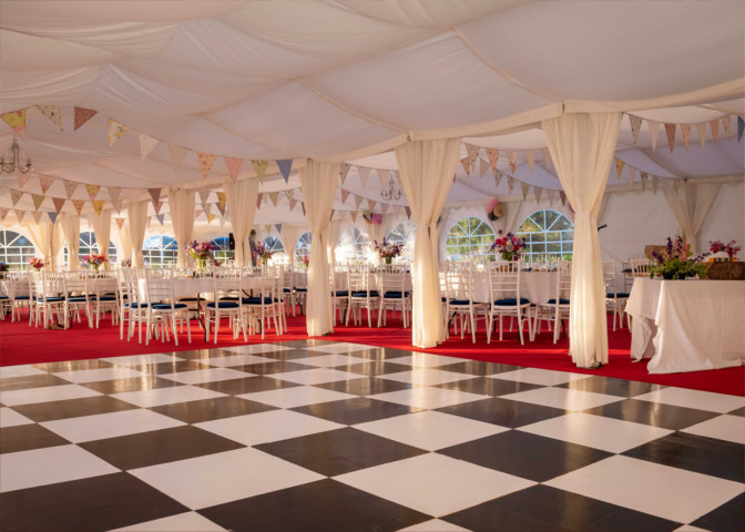 A fully lined 6m wide marquee with roof and curtain and wall linings in ivory