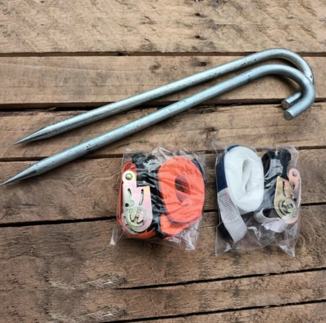 Marquee peg stakes and ratchet tie downs